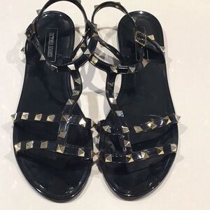 Black V like studded sandals.